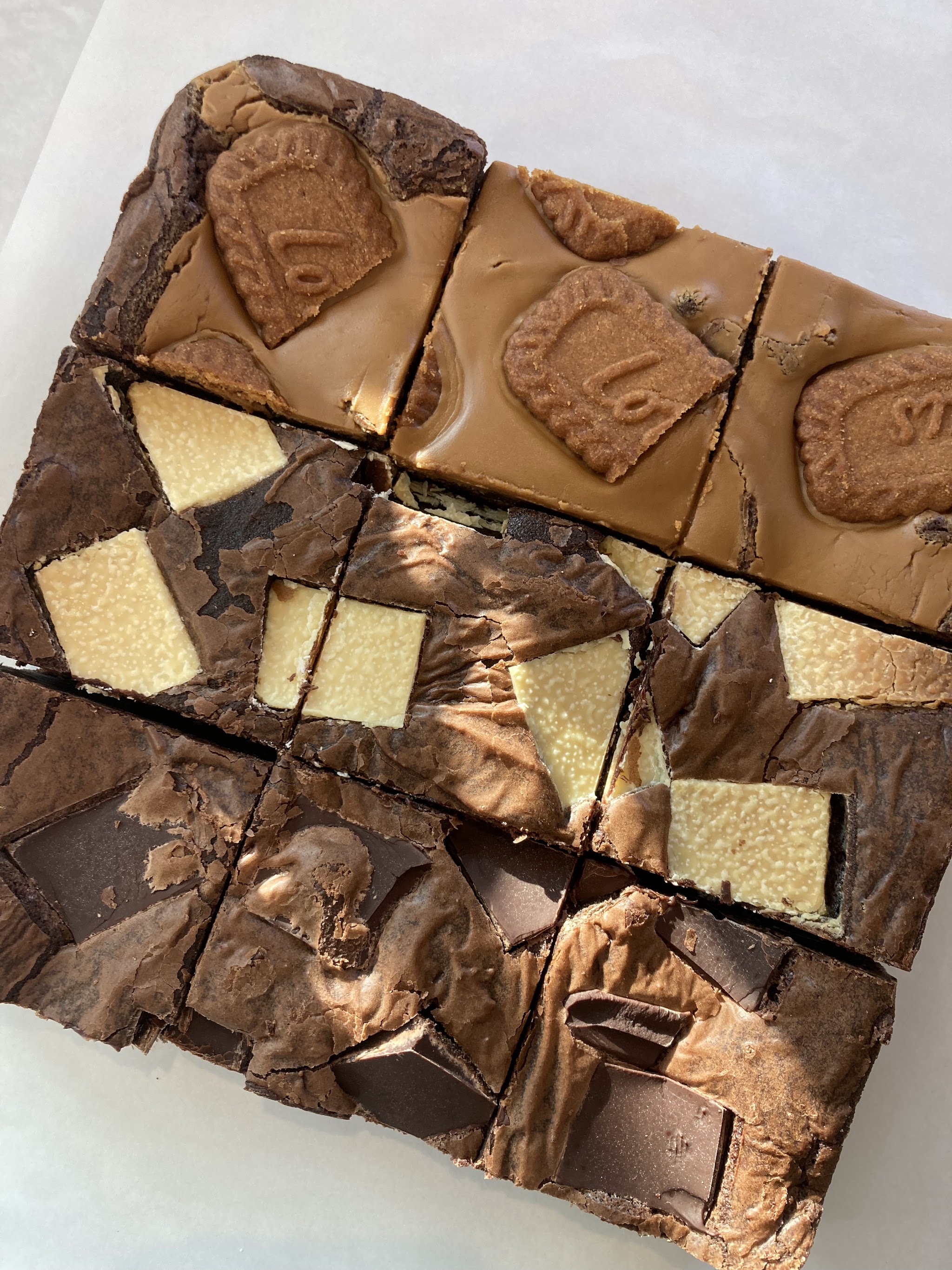 An assortment of chocolate brownies and topped traybakes
