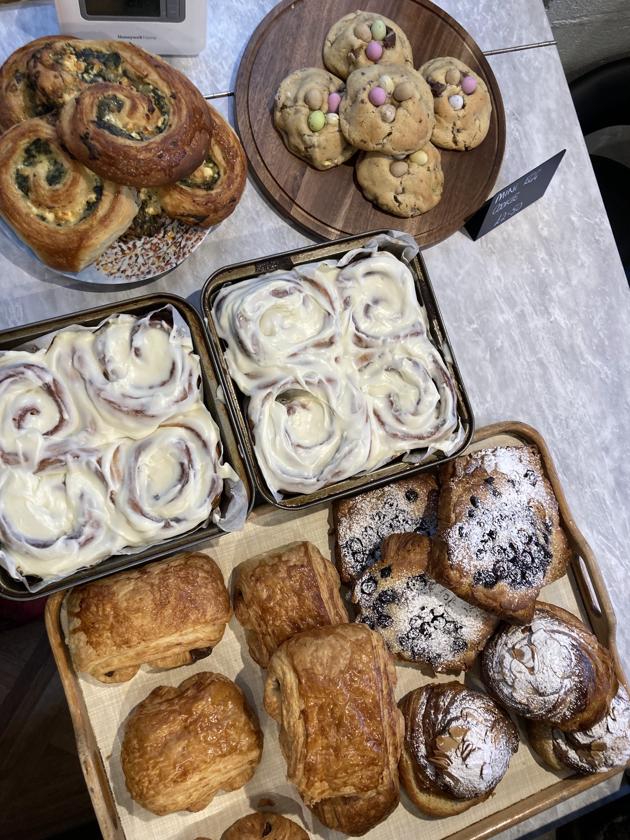 A selection of cinnamon rolls, pastries and other bakes on our counter