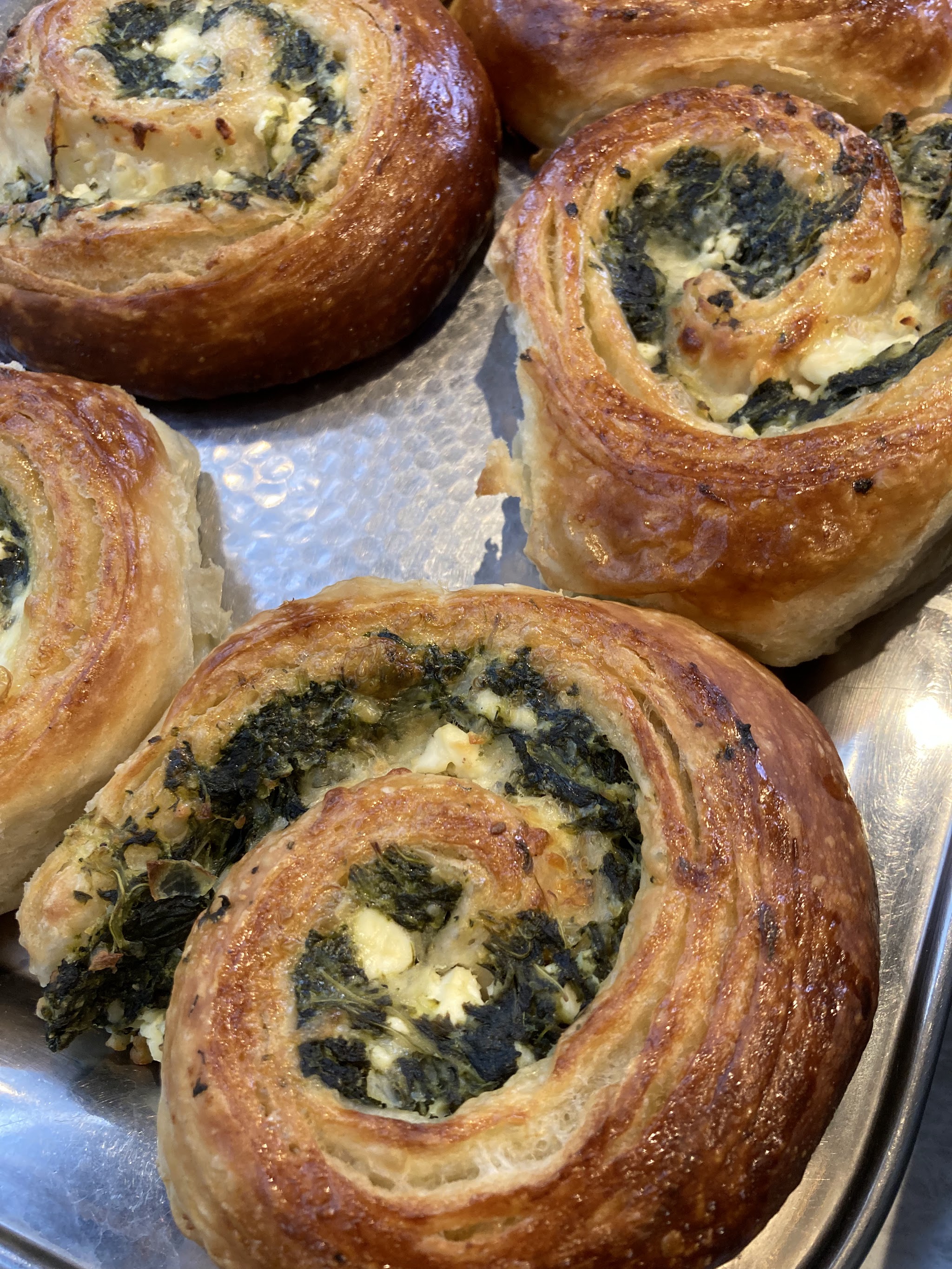 Freshly baked savoury pastries on the counter