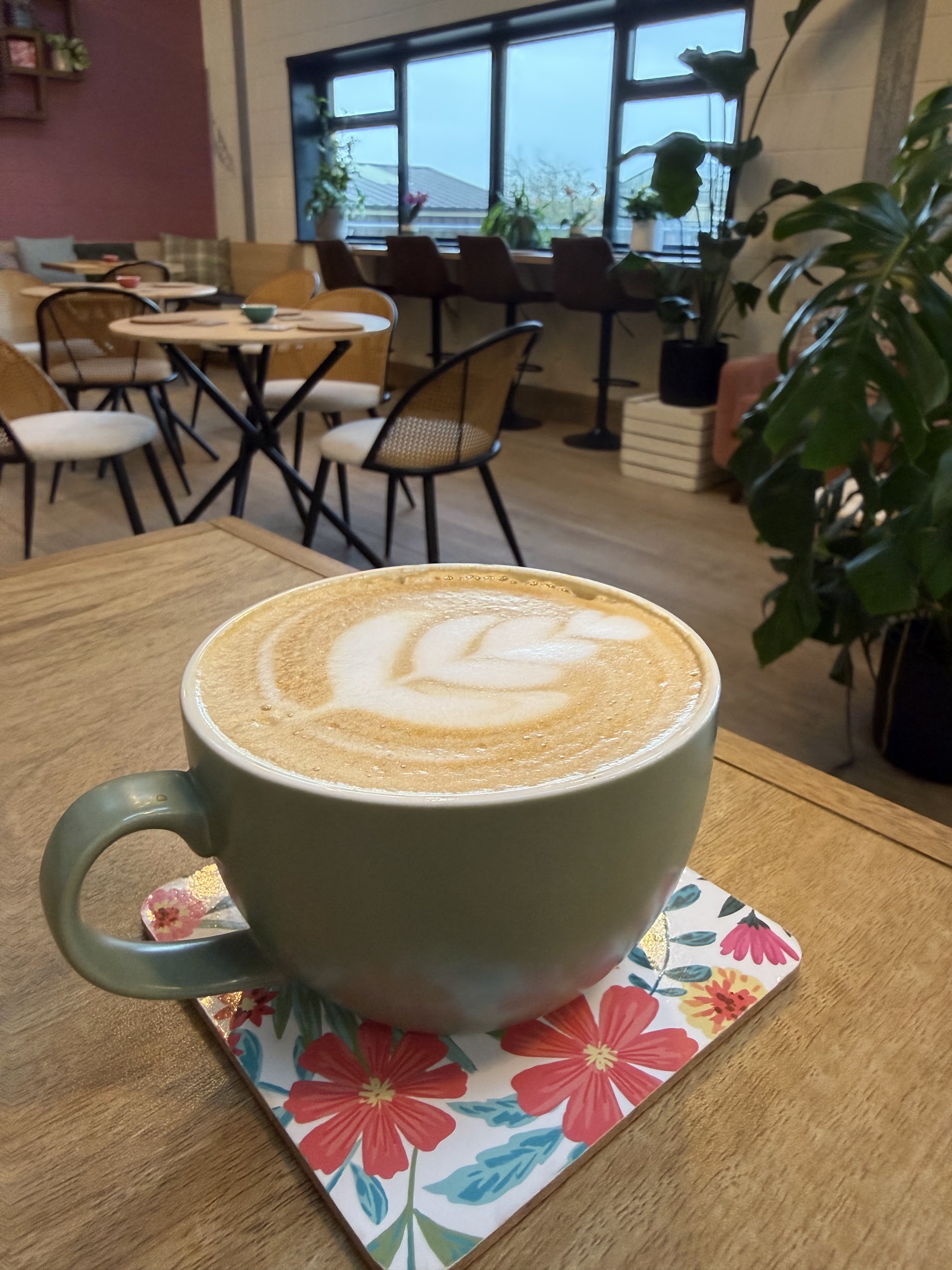A cup of coffee beside the window in The Choccy Pig